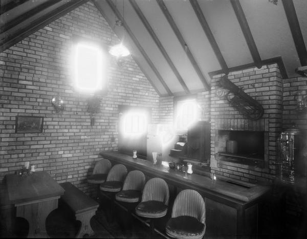 The original BratHaus interior — brick walls, a peaked timber ceiling, and a bar a block off the UW campus.